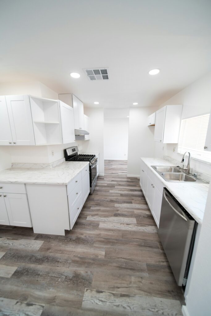 White kitchen cabinets and wood floor, freshly cleaned